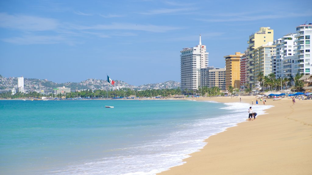 Condesa Beach showing a sandy beach and a coastal town