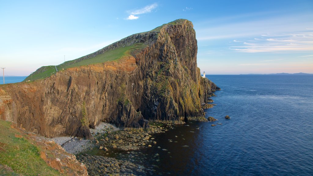 Isle of Skye showing rugged coastline, a lighthouse and mountains