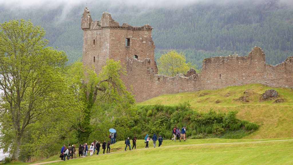 Urquhart Castle featuring heritage elements, a ruin and chateau or palace