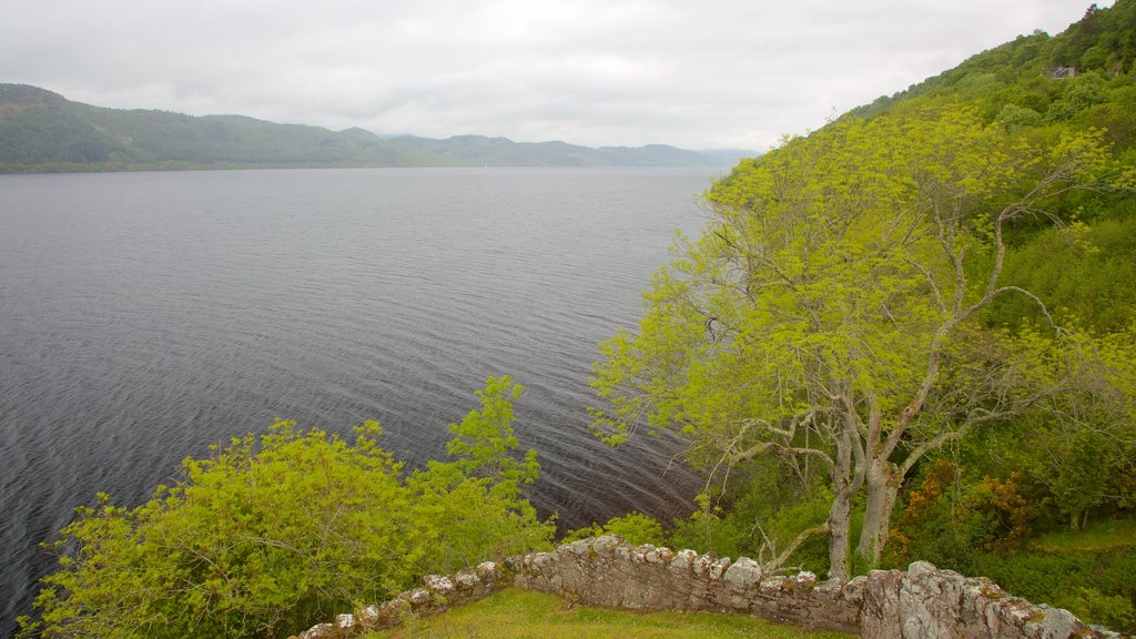 Urquhart Castle featuring a lake or waterhole and building ruins