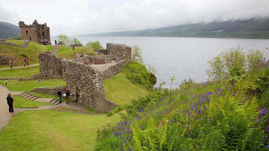 Urquhart Castle which includes building ruins, a lake or waterhole and heritage elements