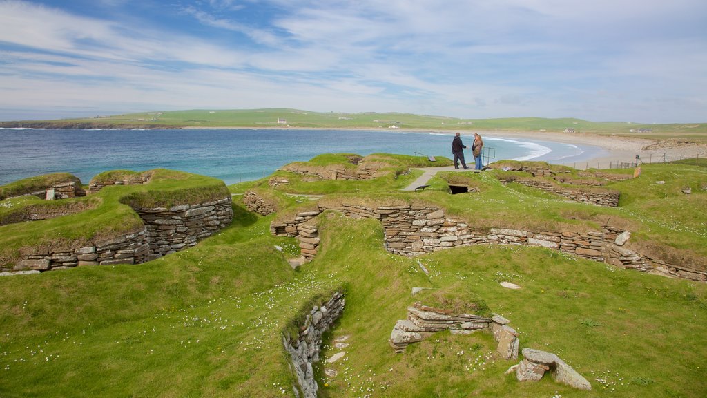 Skara Brae which includes general coastal views, heritage architecture and a bay or harbour