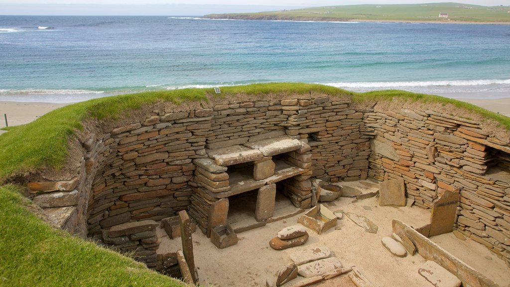 Skara Brae featuring a beach, heritage architecture and a bay or harbour