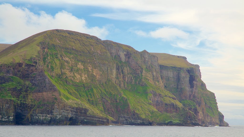 St. John\'s Head featuring mountains and rocky coastline