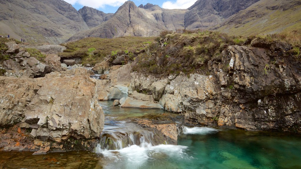 Isle of Skye featuring a pond, tranquil scenes and mountains