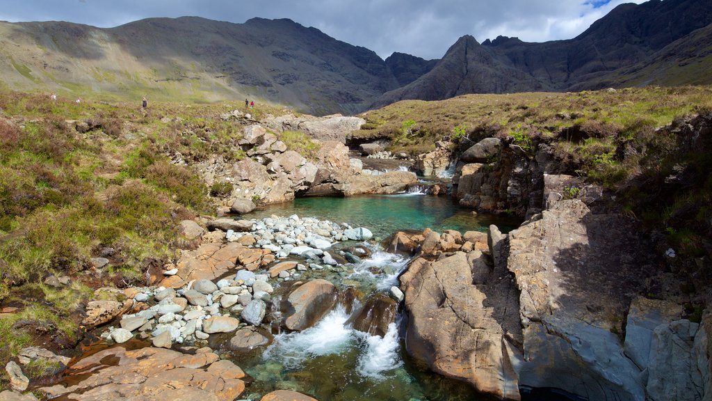 Isle of Skye which includes tranquil scenes, mountains and a pond