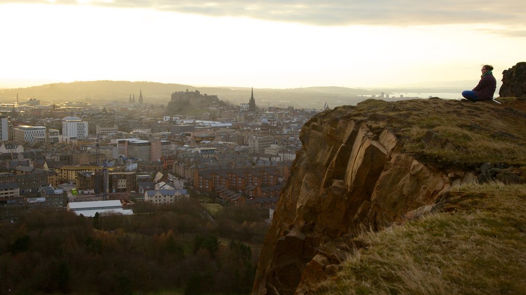 Arthur\'s Seat showing a city as well as an individual female