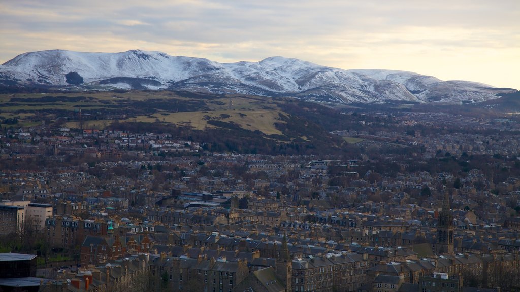 Arthur\'s Seat showing mountains, snow and a city