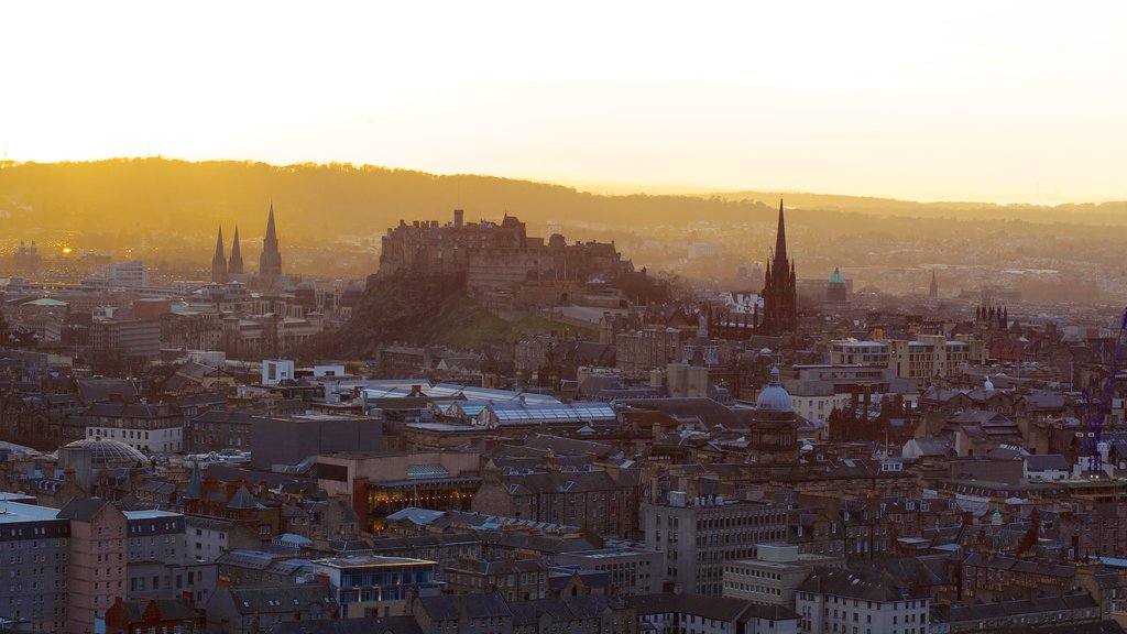 Arthur\'s Seat featuring a sunset and a city