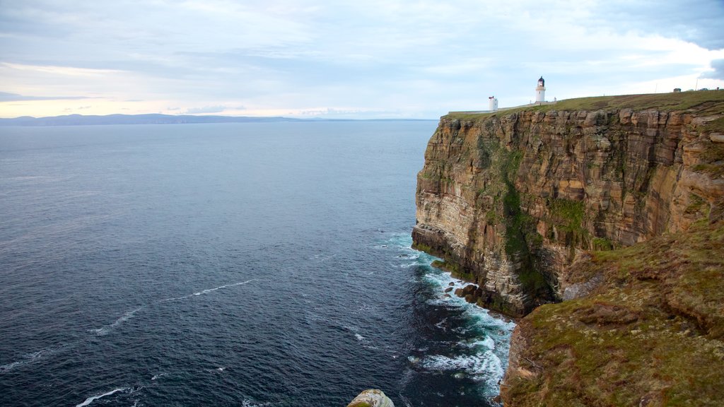 Dunnet Head Lighthouse which includes rugged coastline and a lighthouse