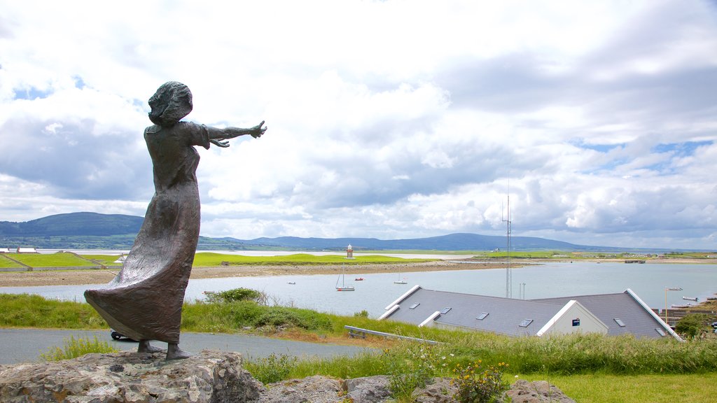 Rosses Point showing landscape views, a statue or sculpture and a bay or harbour