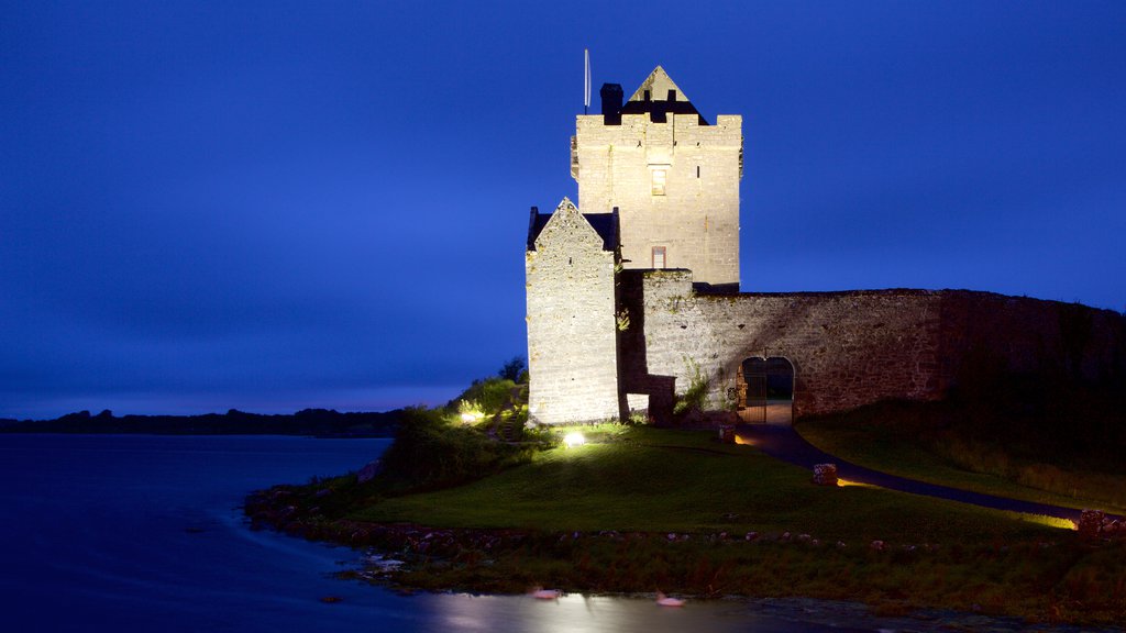 Dunguaire Castle showing night scenes, heritage elements and a river or creek