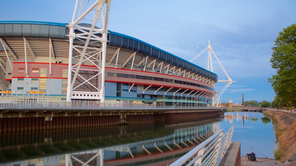 Millennium Stadium showing modern architecture and a river or creek