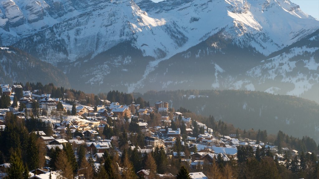 Villars which includes a small town or village, snow and landscape views