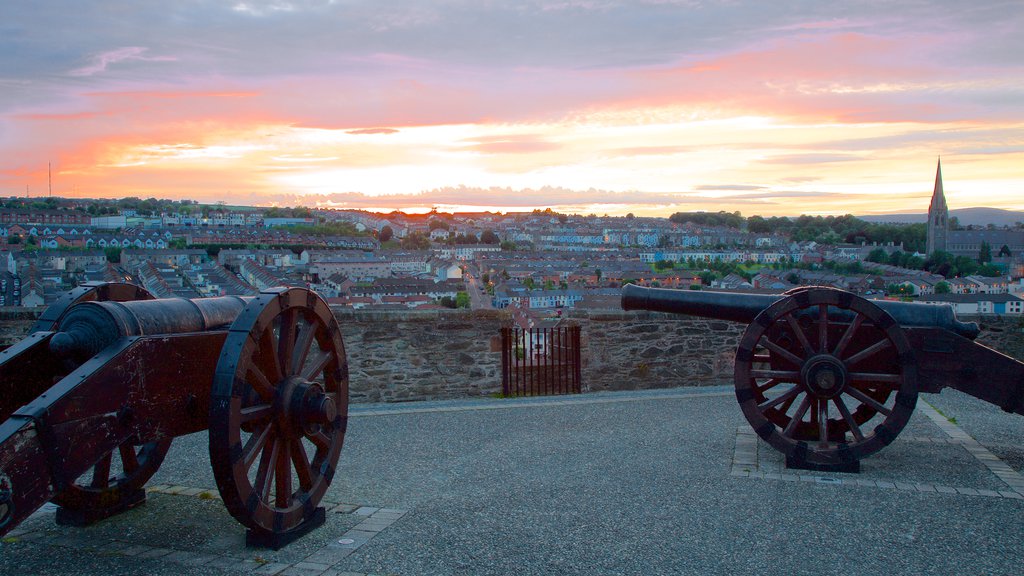 Derry City Walls which includes a city, heritage elements and a sunset