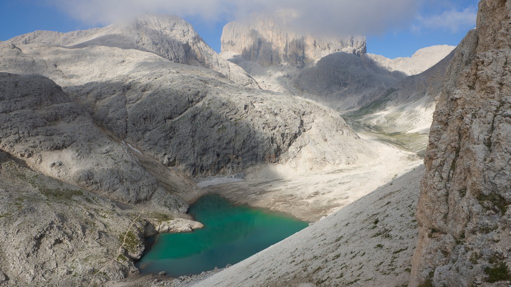 Fassa Valley which includes tranquil scenes, a pond and mountains