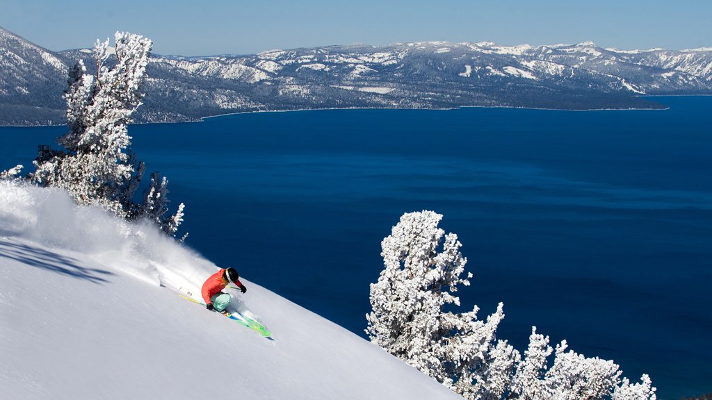 Heavenly Ski Resort showing a lake or waterhole, mountains and snowboarding