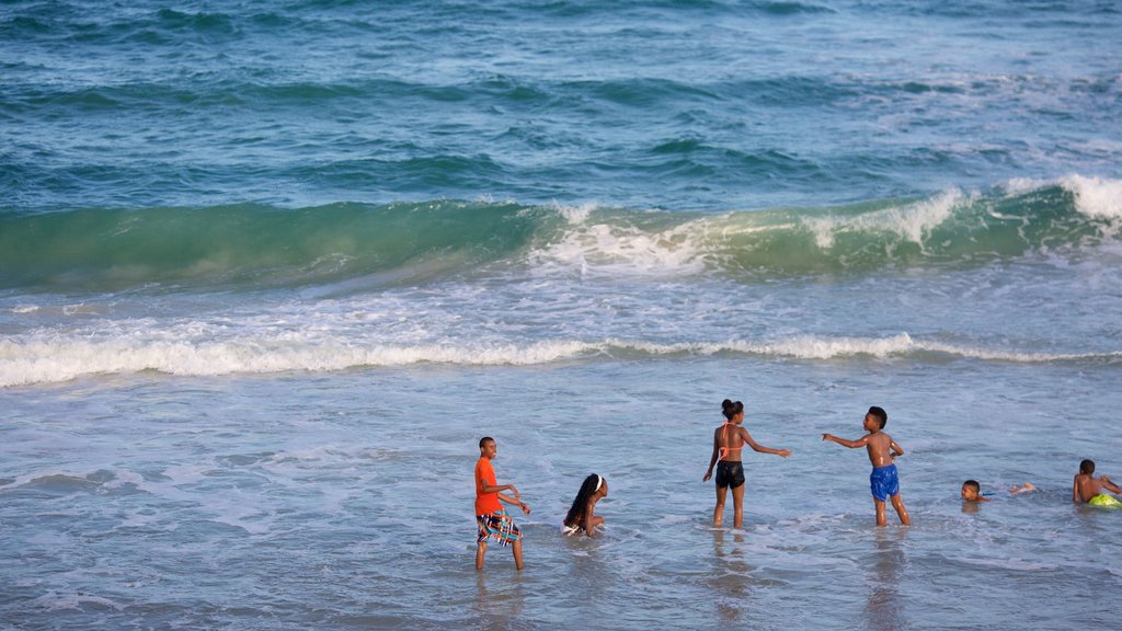 Wrightsville Beach which includes general coastal views and a beach as well as children