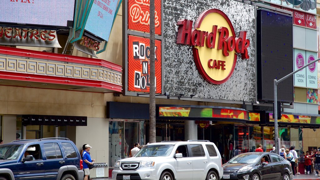 Hollywood Boulevard showing signage and street scenes as well as a small group of people