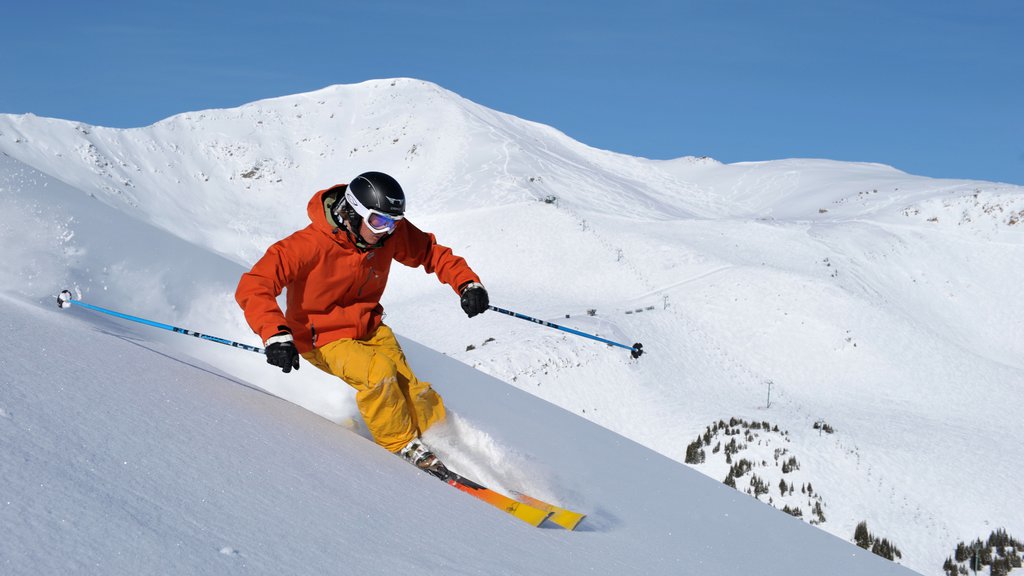 Marmot Basin showing snow and snow skiing as well as an individual male