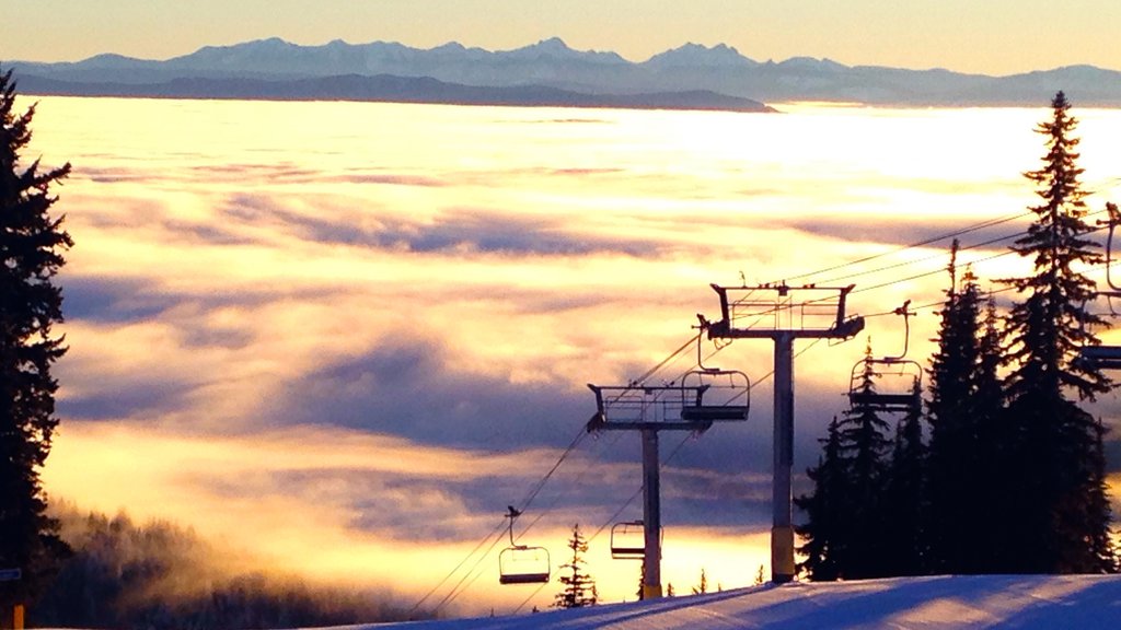 Silver Star Ski Resort which includes a sunset, snow and a gondola