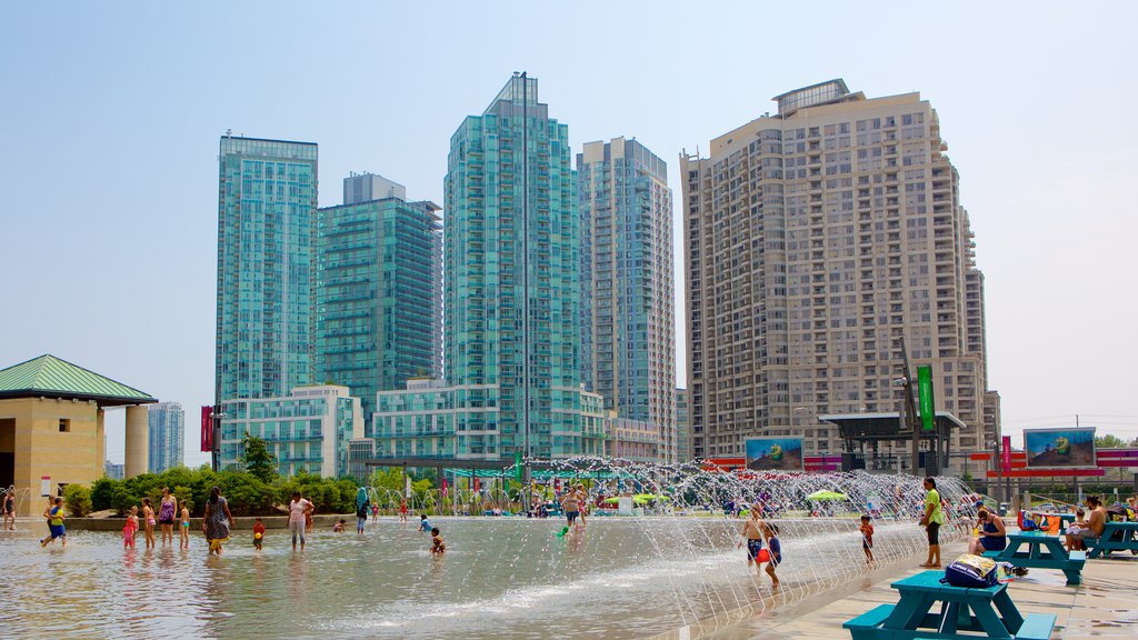 Mississauga Civic Centre featuring a fountain, a city and swimming