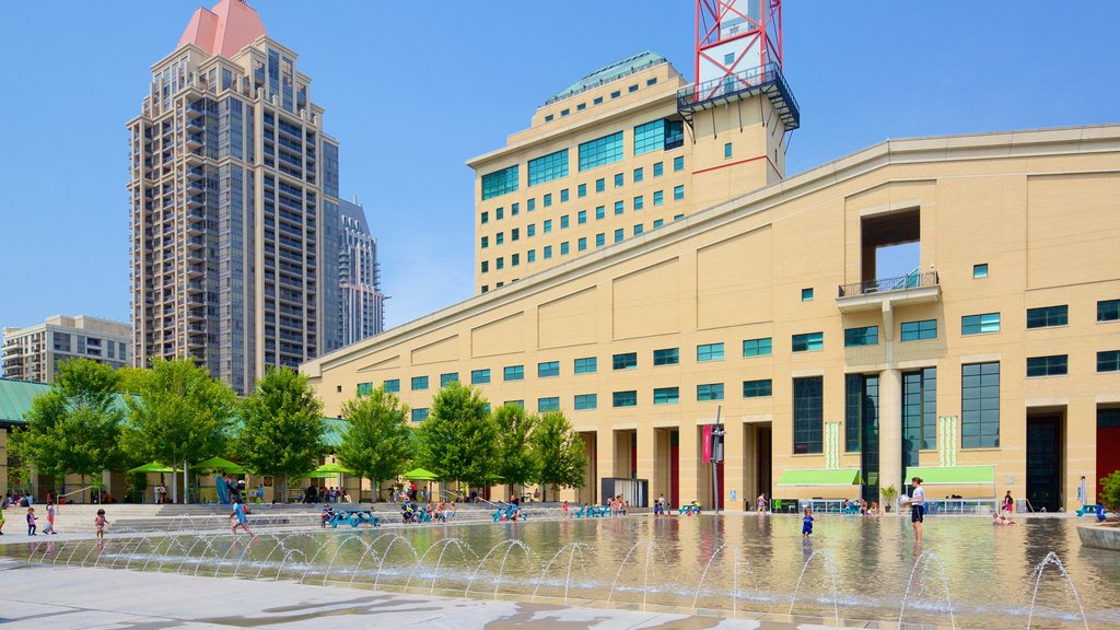 Mississauga Civic Centre showing swimming, a city and a fountain