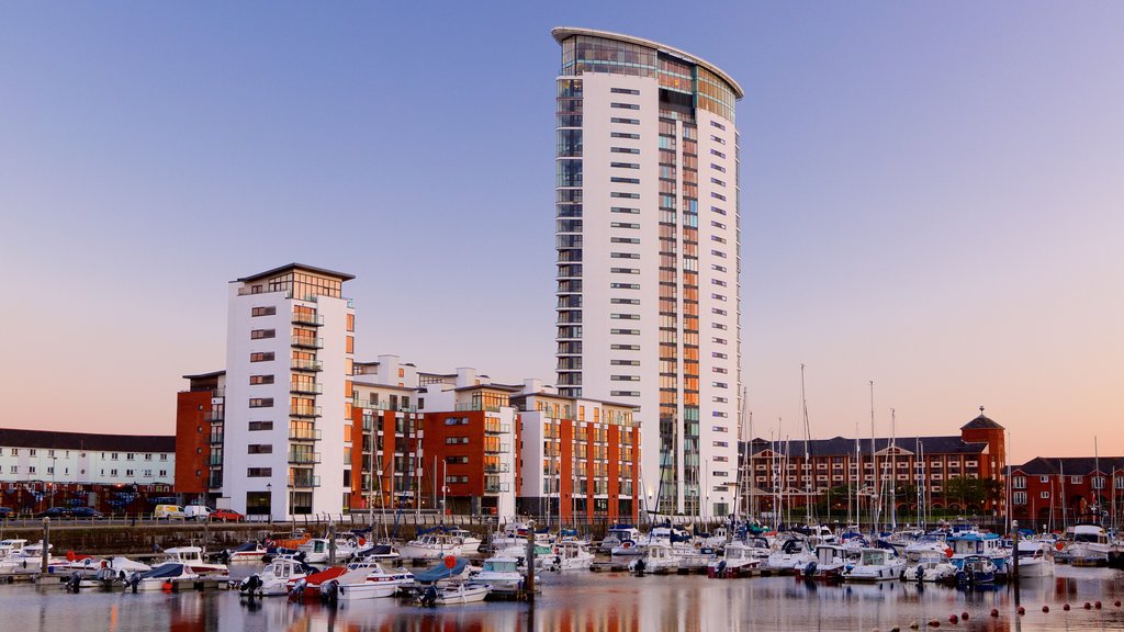 Swansea which includes a sunset, general coastal views and a city