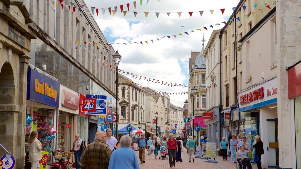 Neath showing street scenes as well as a large group of people