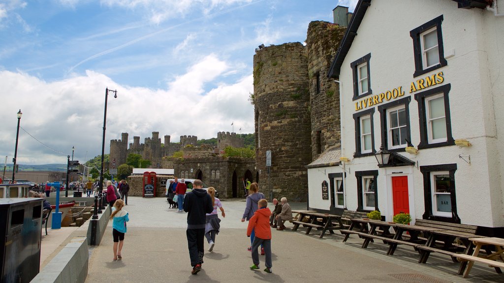 Conwy featuring street scenes as well as a small group of people