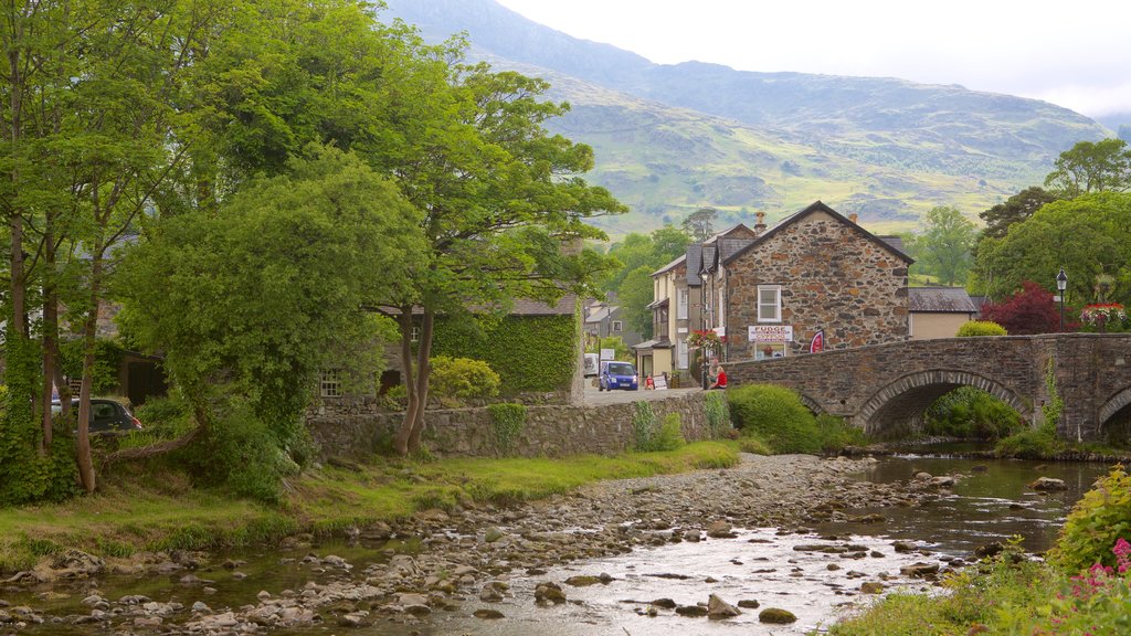 Beddgelert showing a river or creek, a bridge and a small town or village