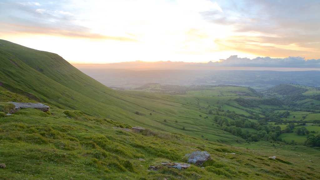 Brecon Beacons National Park featuring farmland, mountains and a sunset