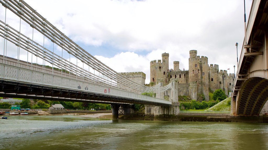 Conwy Castle featuring château or palace, a river or creek and a bridge