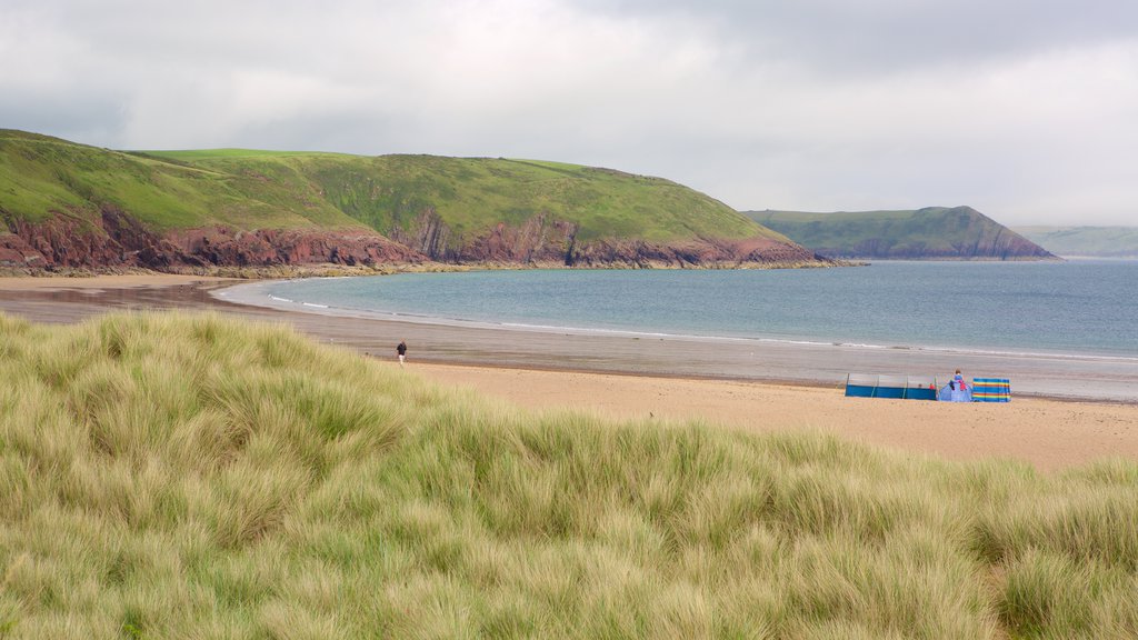 Freshwater East Beach which includes a bay or harbor, general coastal views and a sandy beach