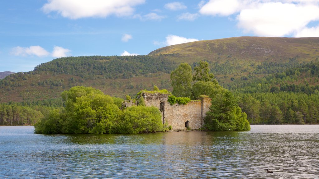 Loch an Eilein featuring heritage elements, mountains and a river or creek