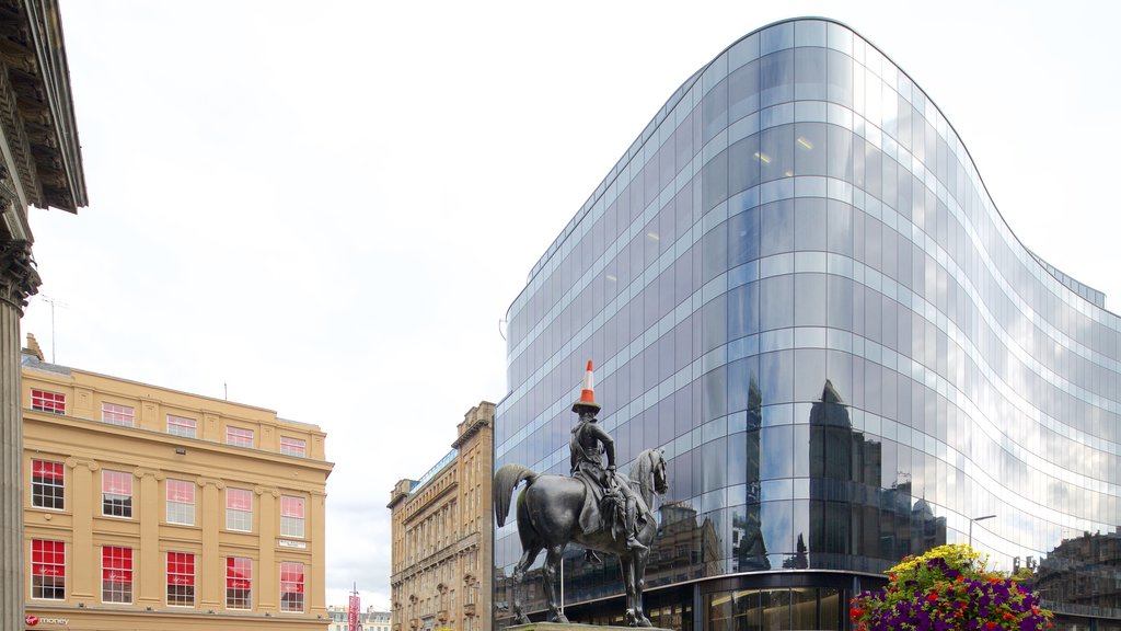 Glasgow featuring a statue or sculpture and modern architecture