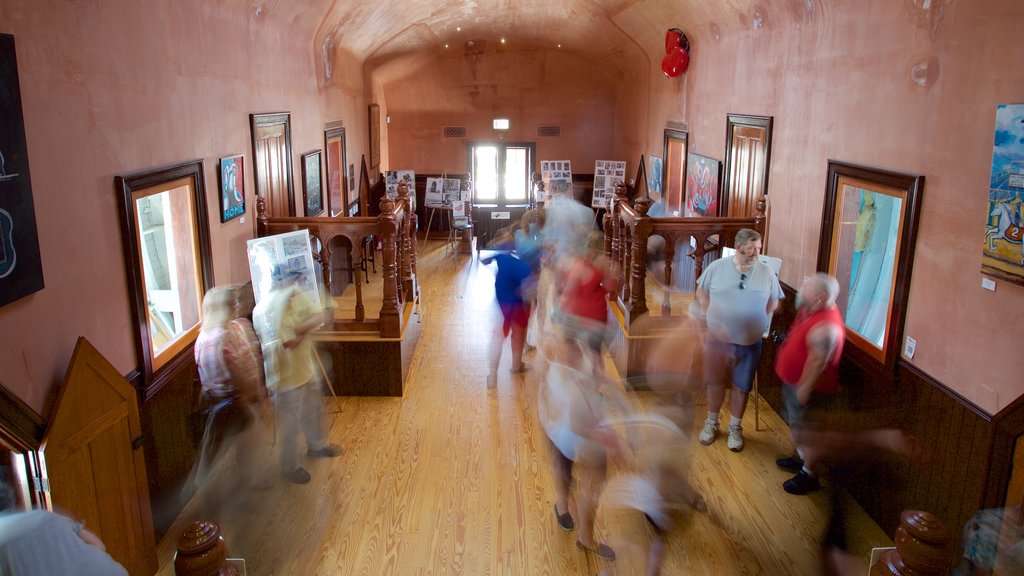 Lucy the Elephant showing interior views as well as a small group of people