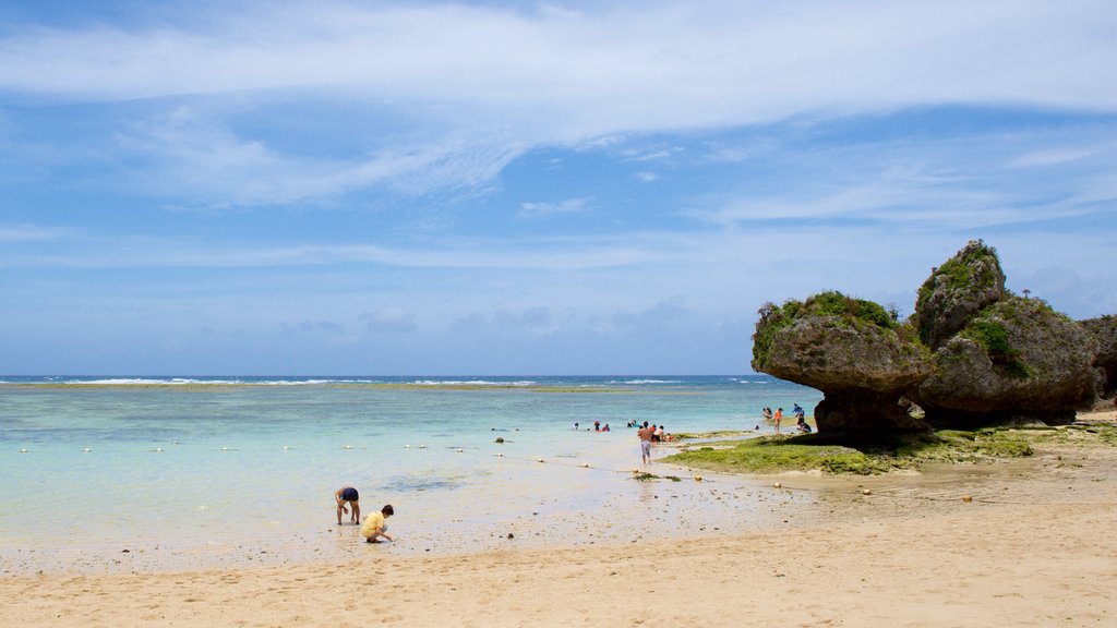 Nirai Beach which includes swimming and a beach