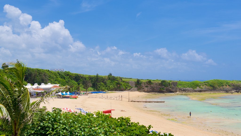 Nirai Beach showing a sandy beach and a coastal town