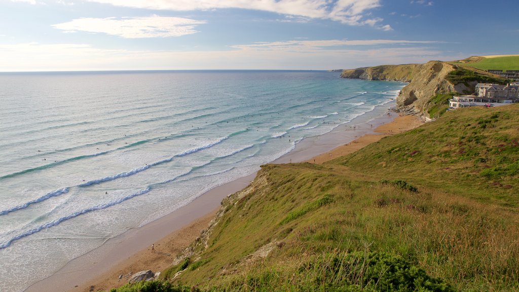 Watergate Bay showing a coastal town, a beach and landscape views