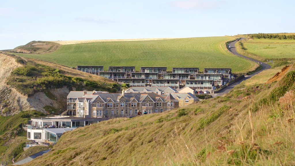 Watergate Bay showing a coastal town and a house