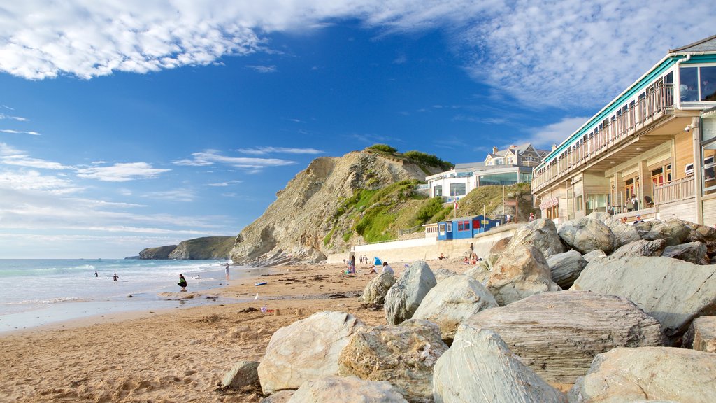 Watergate Bay which includes a sandy beach and a coastal town