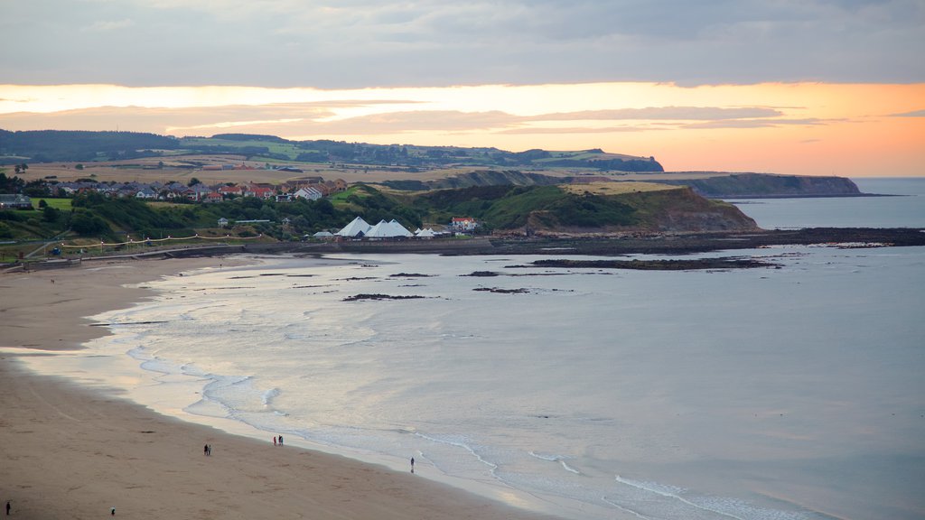 North Bay Beach showing landscape views, a sandy beach and a sunset