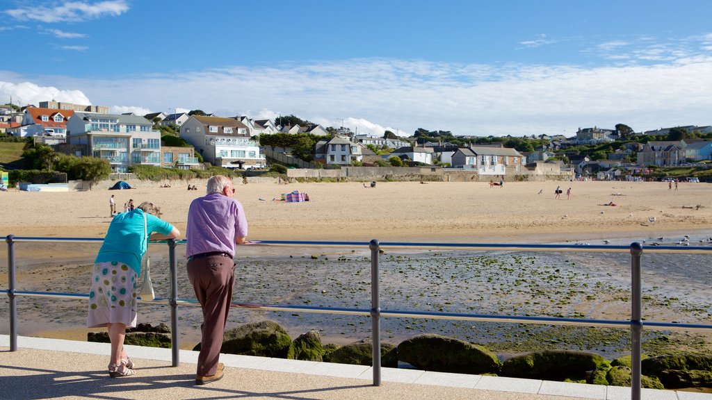 Porth Beach featuring a beach and a coastal town