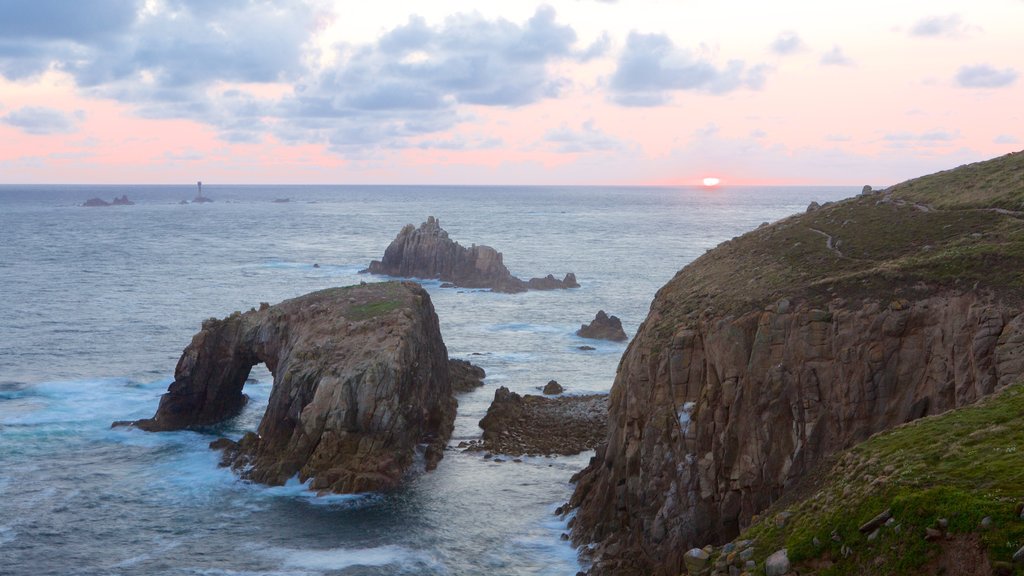 Land\'s End featuring a sunset and rocky coastline