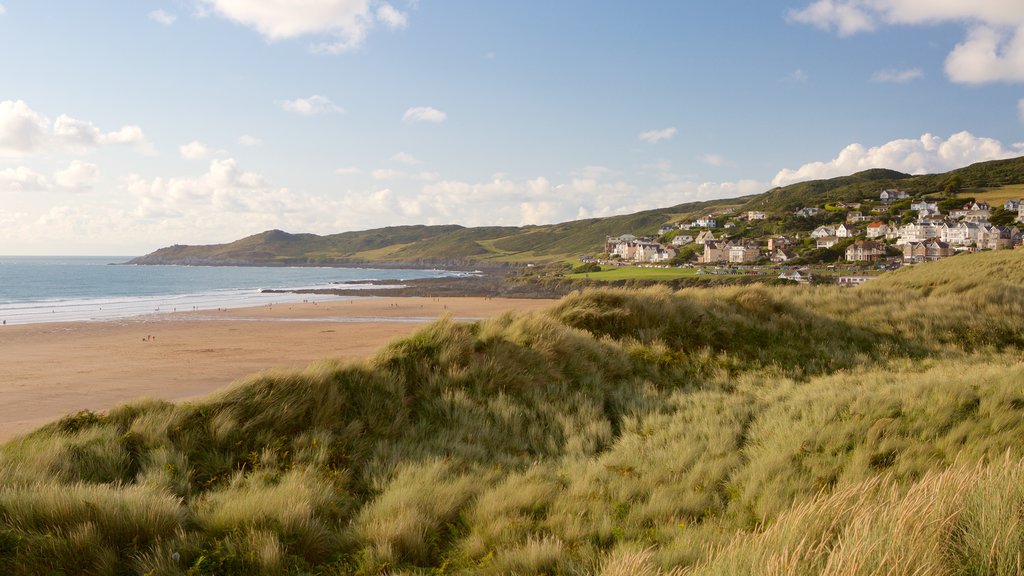 Woolacombe featuring a sandy beach, landscape views and a coastal town