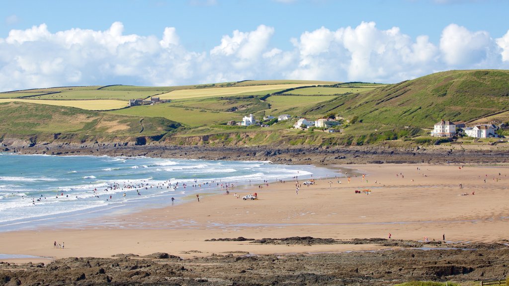 Croyde which includes rocky coastline, a beach and landscape views