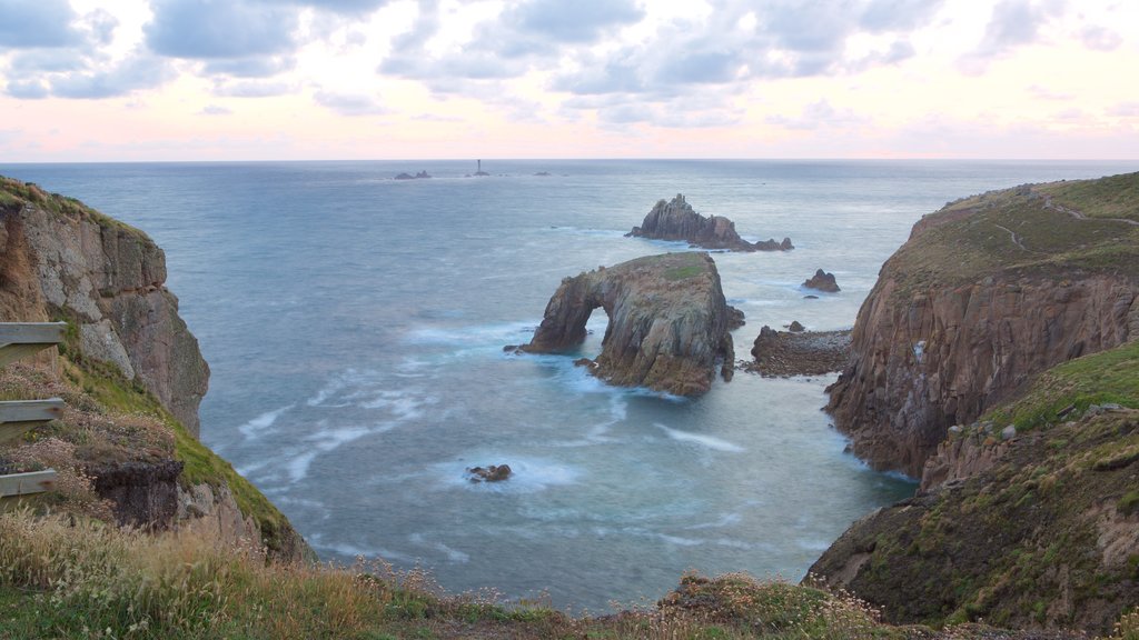 Land\'s End showing a sunset, landscape views and rocky coastline