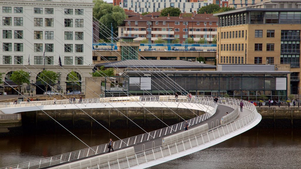 Gateshead Millennium Bridge showing a river or creek, modern architecture and a bridge