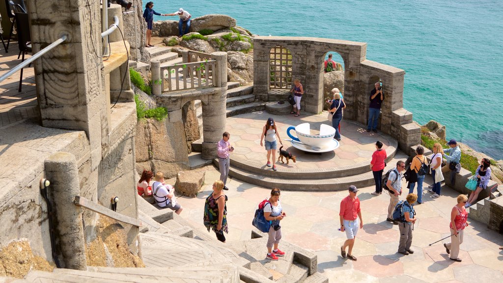 Minack Theatre featuring heritage elements, general coastal views and theater scenes